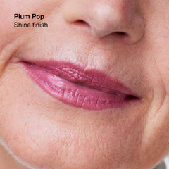 Clinique Pop lipstick in hand illustrating size and travel-friendly benefit
