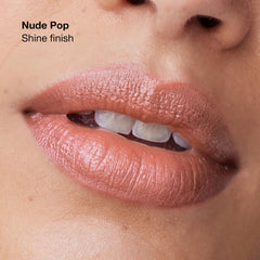 Clinique Pop applied on model smiling in daylight to show real-life wear and glow