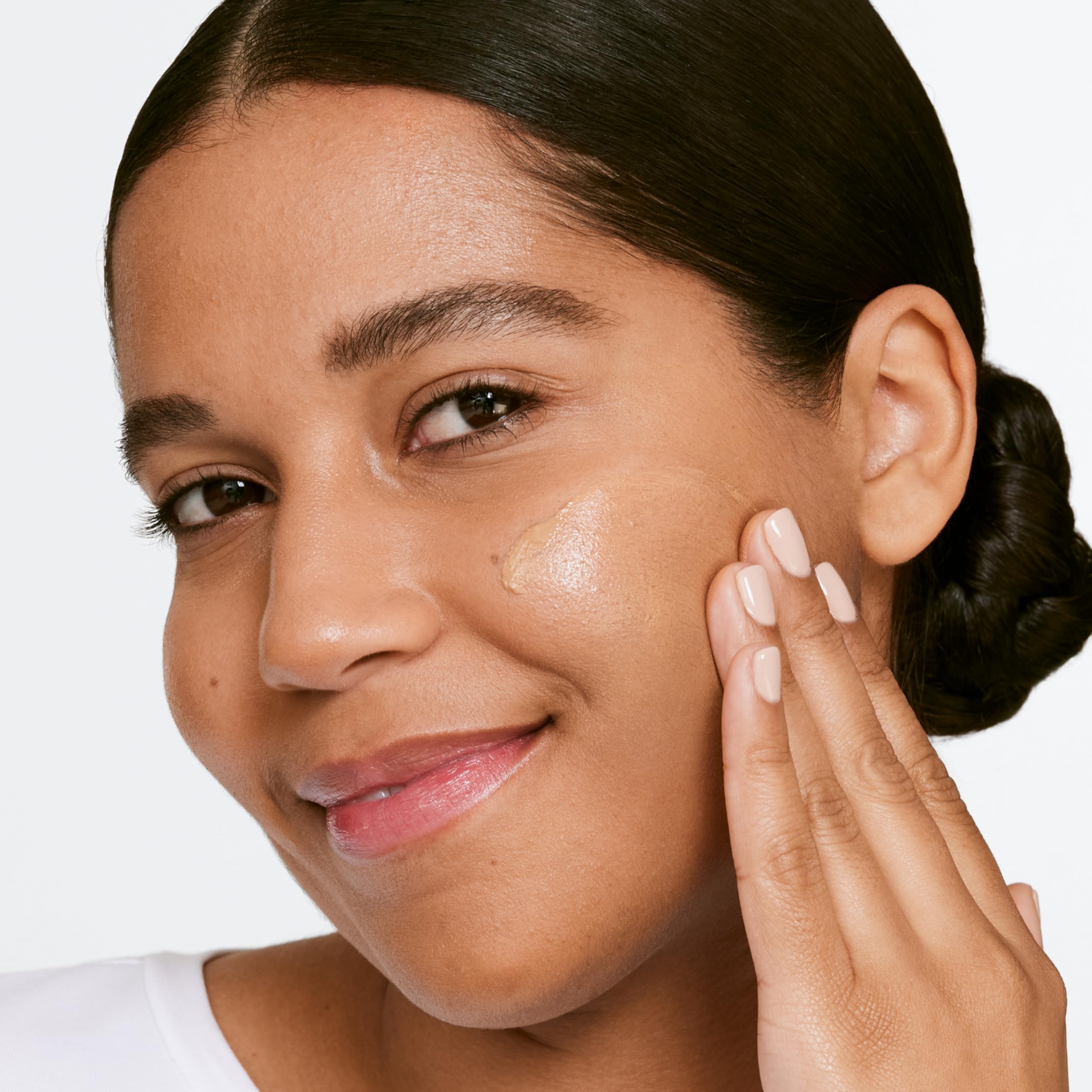 Clinique tube in hand for size scale and travel-friendly hydration benefit