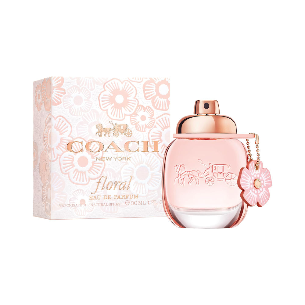 Coach bottle in a meadow setting illustrating sunny floral mood