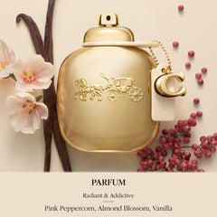 Coach gold nozzle closeup emphasizing fine mist and easy application