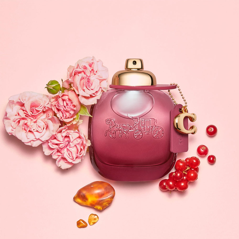 Coach Wild Rose close-up of bottle glass and rose-inspired accents emphasizing design