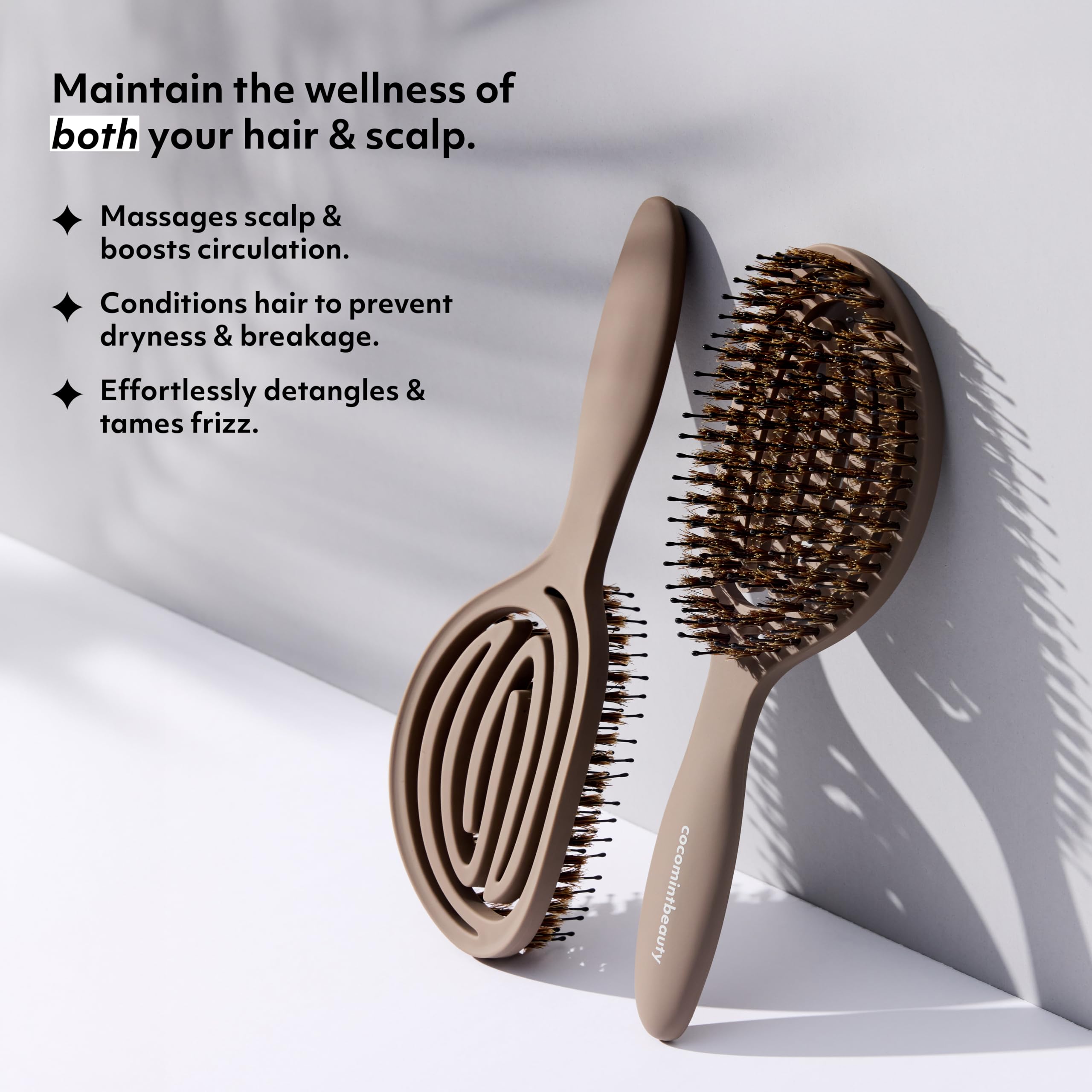 cocomintbeauty brush held in hand to show scale and lightweight design, reduces wrist strain
