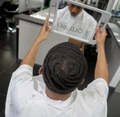 COLDLABEL in barbershop setting with stylist styling client for professional finish benefit