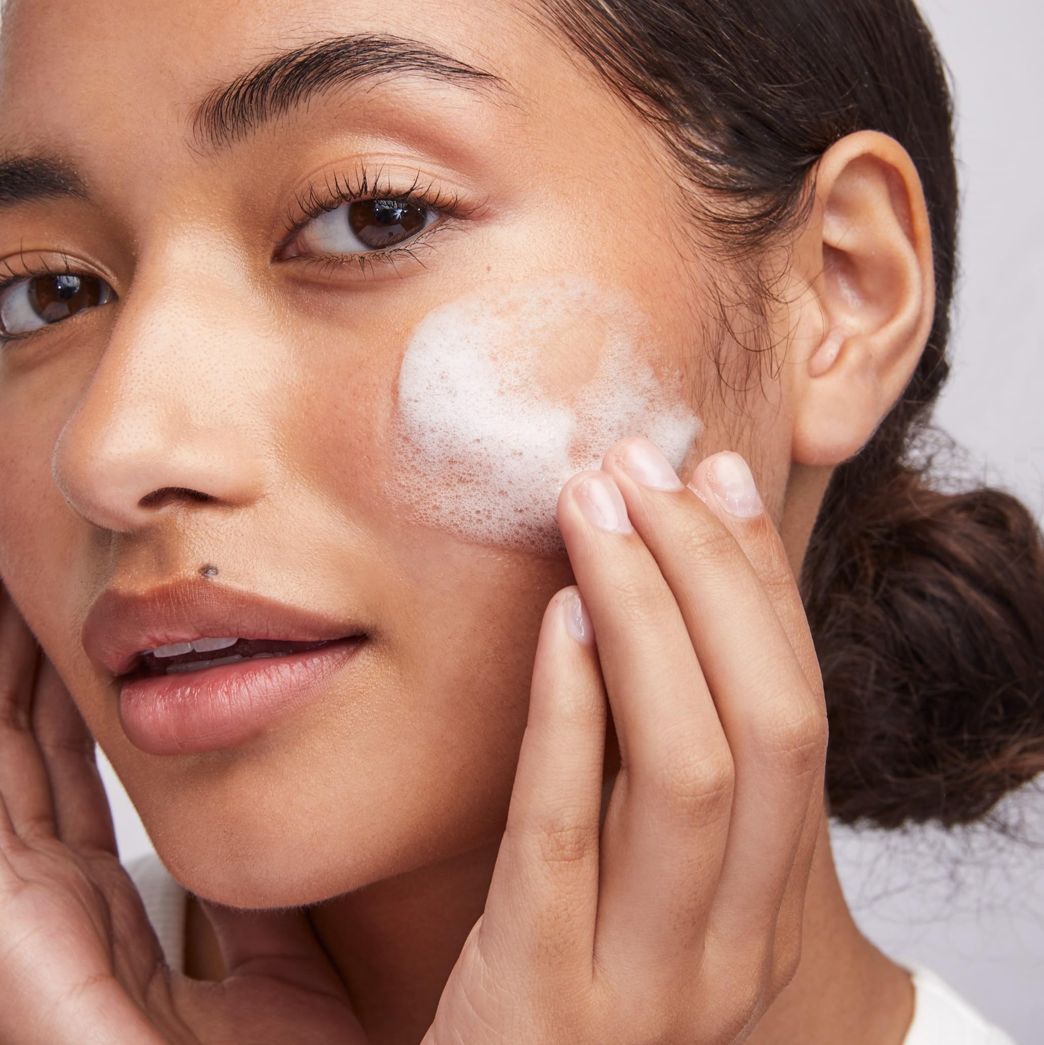 Colorescience texture foam on palm illustrating light lather that rinses clean