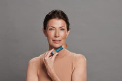 Colorescience brush-on shield Bronze applied on model for on-the-go protection