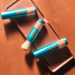 Colorescience brush-on shield Bronze powder texture swatch showing blendable finish