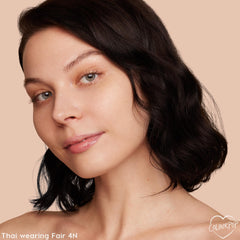ColourPop product being applied from a spoon demonstrating lightweight, buildable coverage