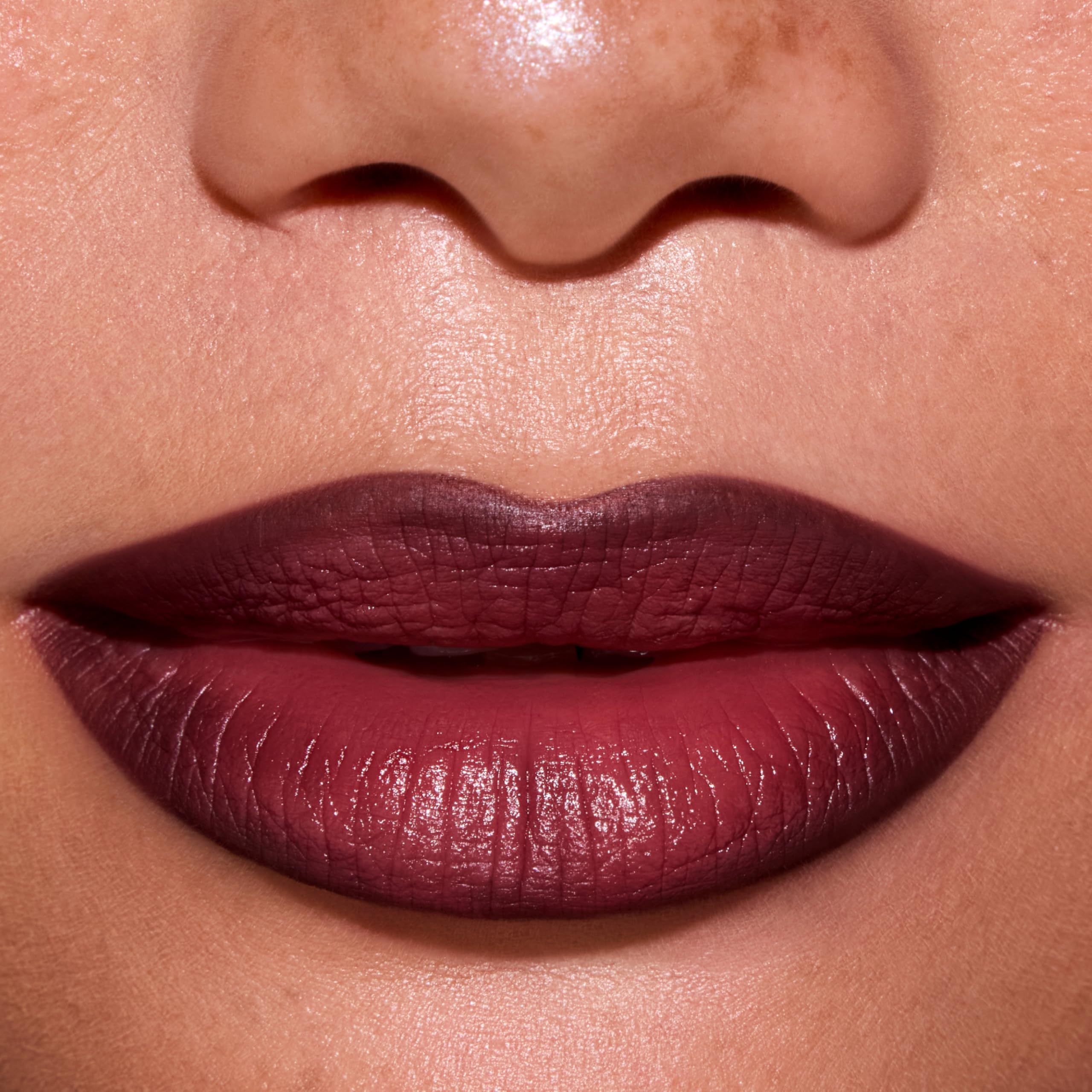 ColourPop swatch on arm warm burgundy brown illustrating rich pigmentation