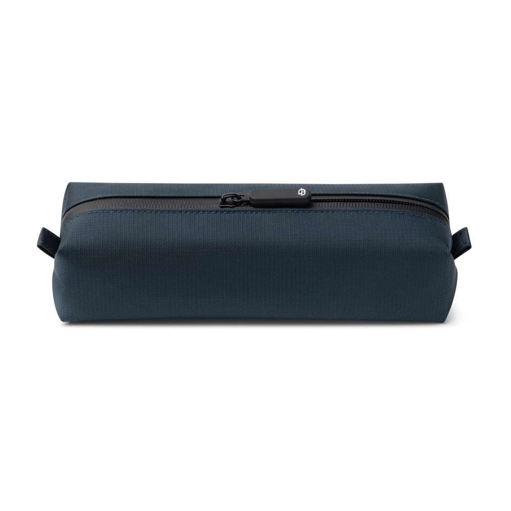 Comfyable front view of blue slim toiletry bag showing compact shape and portability