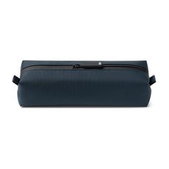 Comfyable front view of blue slim toiletry bag showing compact shape and portability