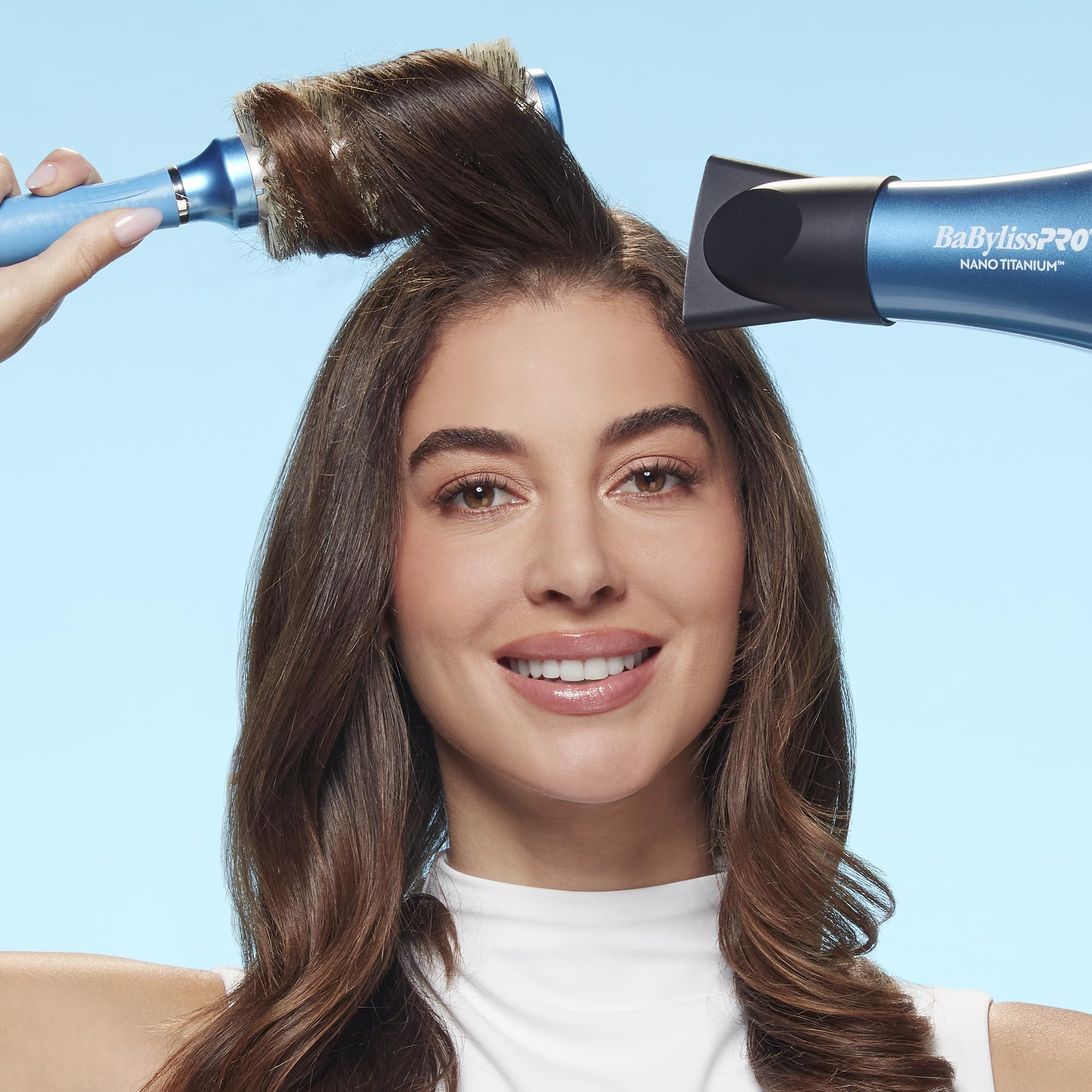 Conair BaBylissPRO next to hand to show 1.3 inch size and control
