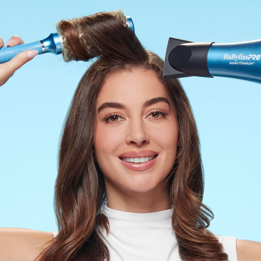 Conair BaBylissPRO next to hand to show 1.3 inch size and control