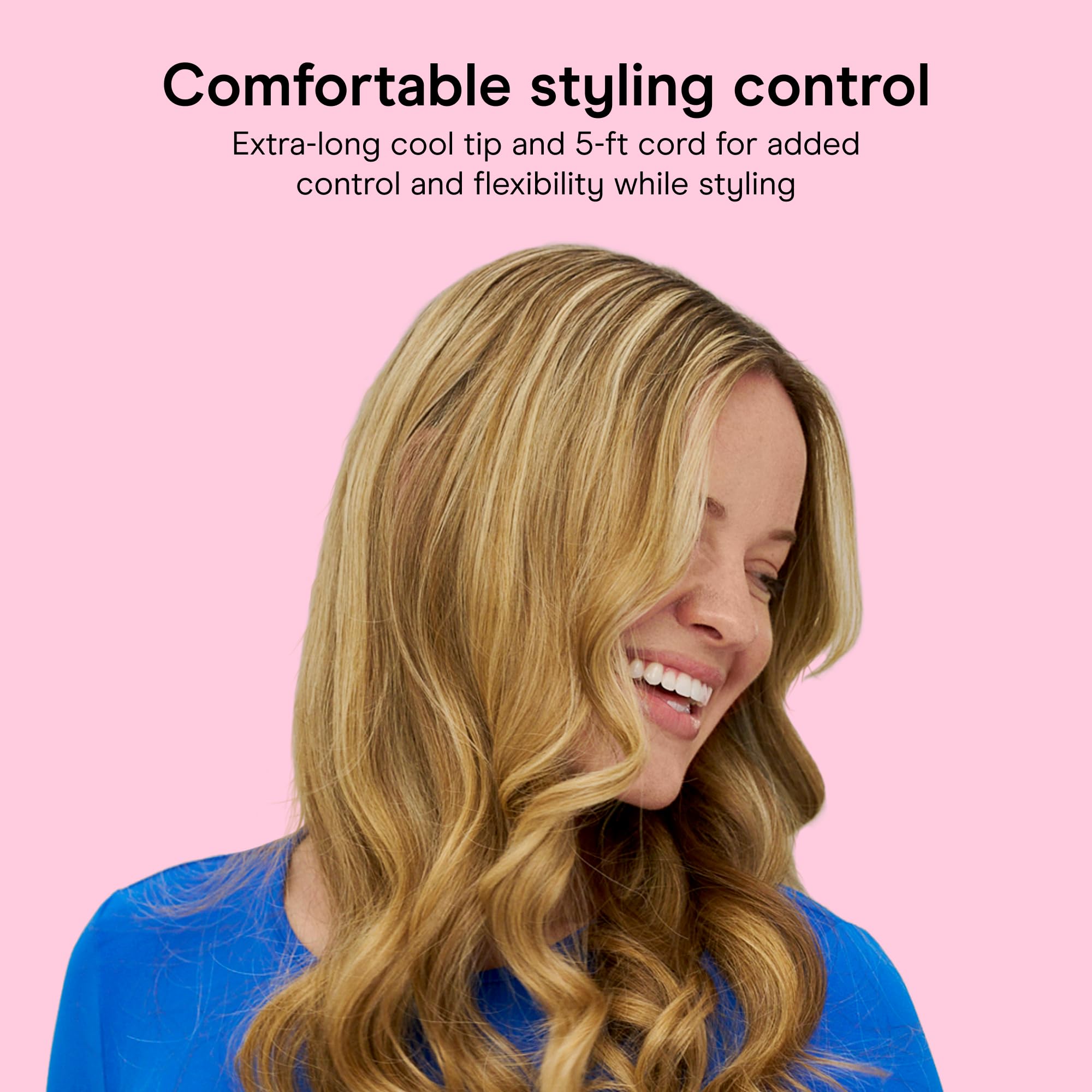 Conair curling iron beside a ruler showing compact size for travel