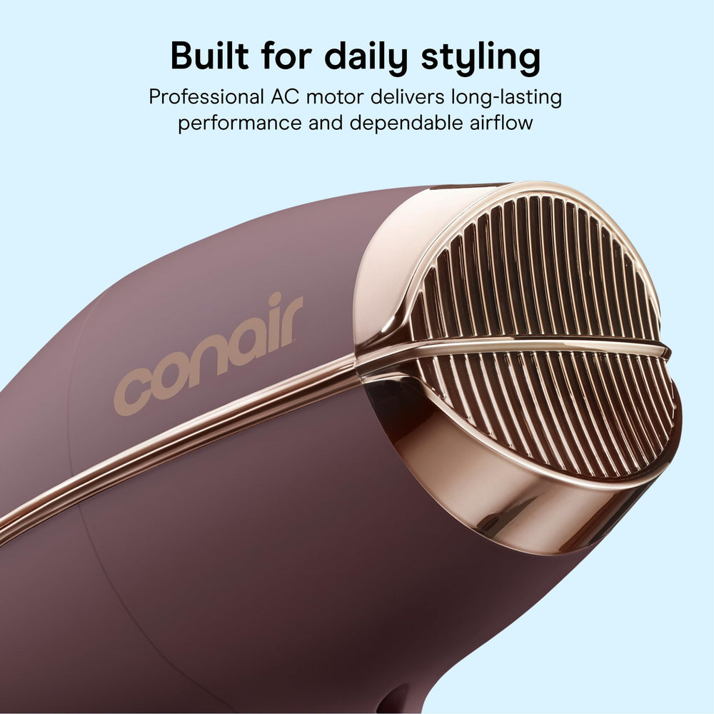Conair in use with concentrator producing sleek, straight finish