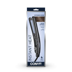 Conair straightener next to hand to show compact size and travel convenience