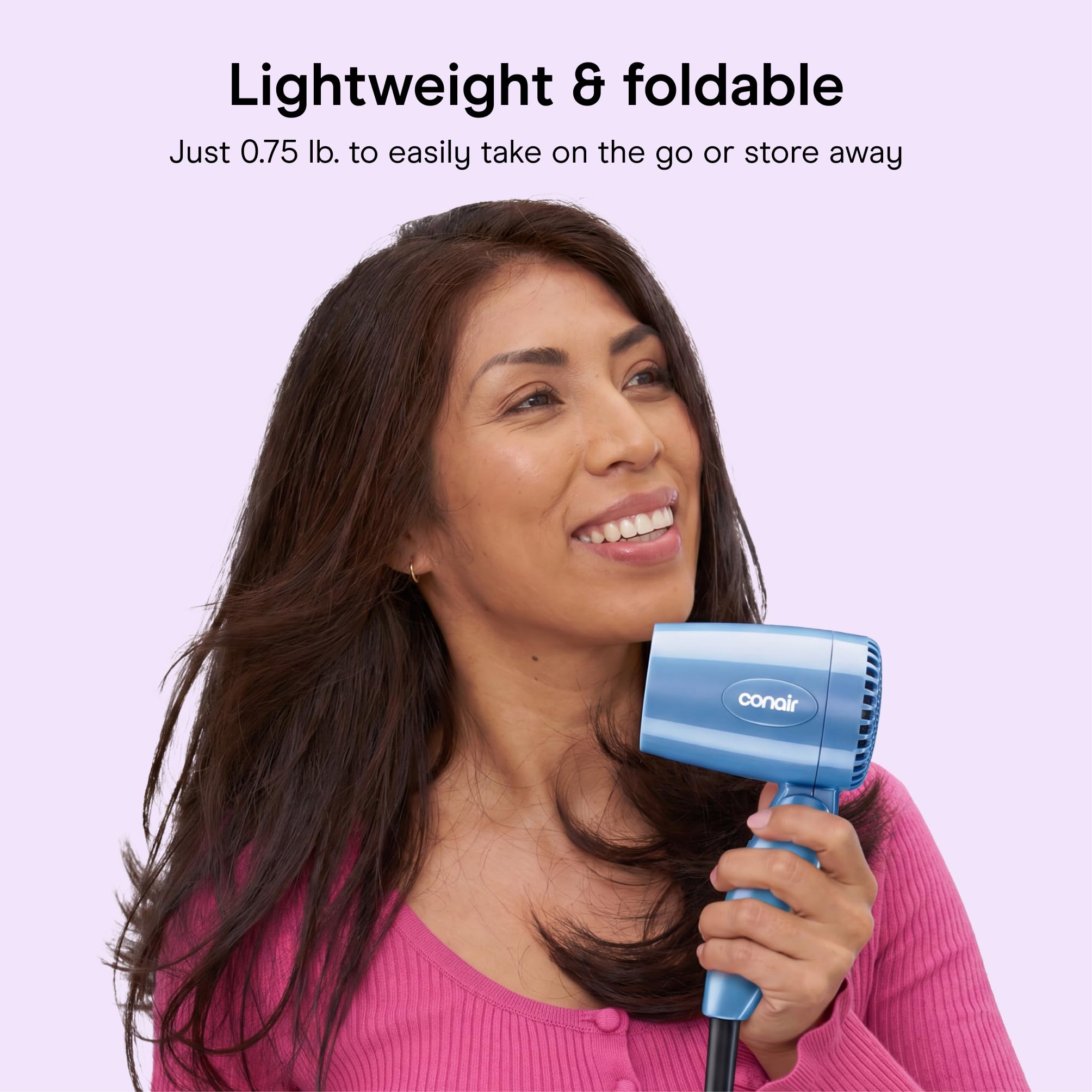 Conair held in hand to show lightweight 0.75 lb. design and comfort
