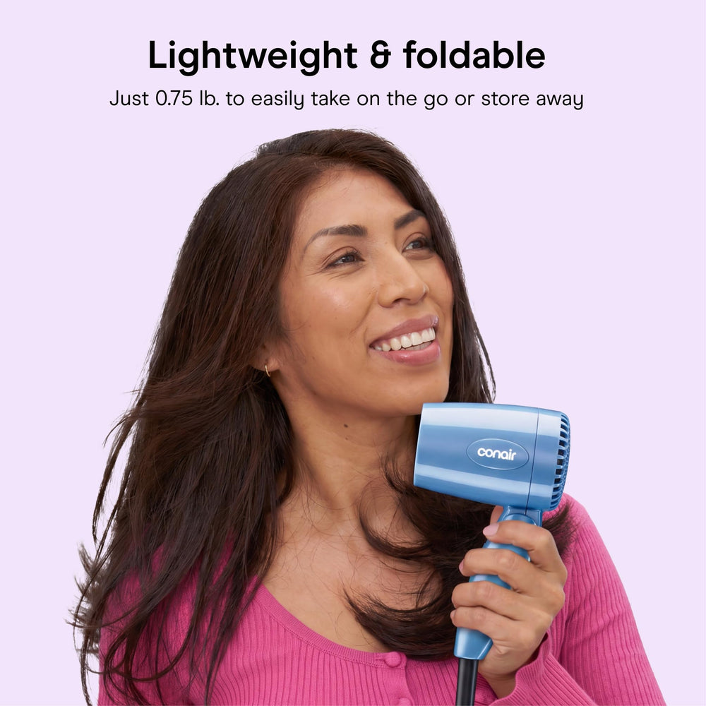 Conair held in hand to show lightweight 0.75 lb. design and comfort