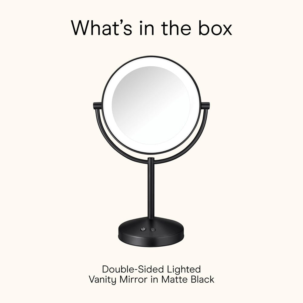 Conair mirror with hand for scale showing compact size and easy tabletop placement