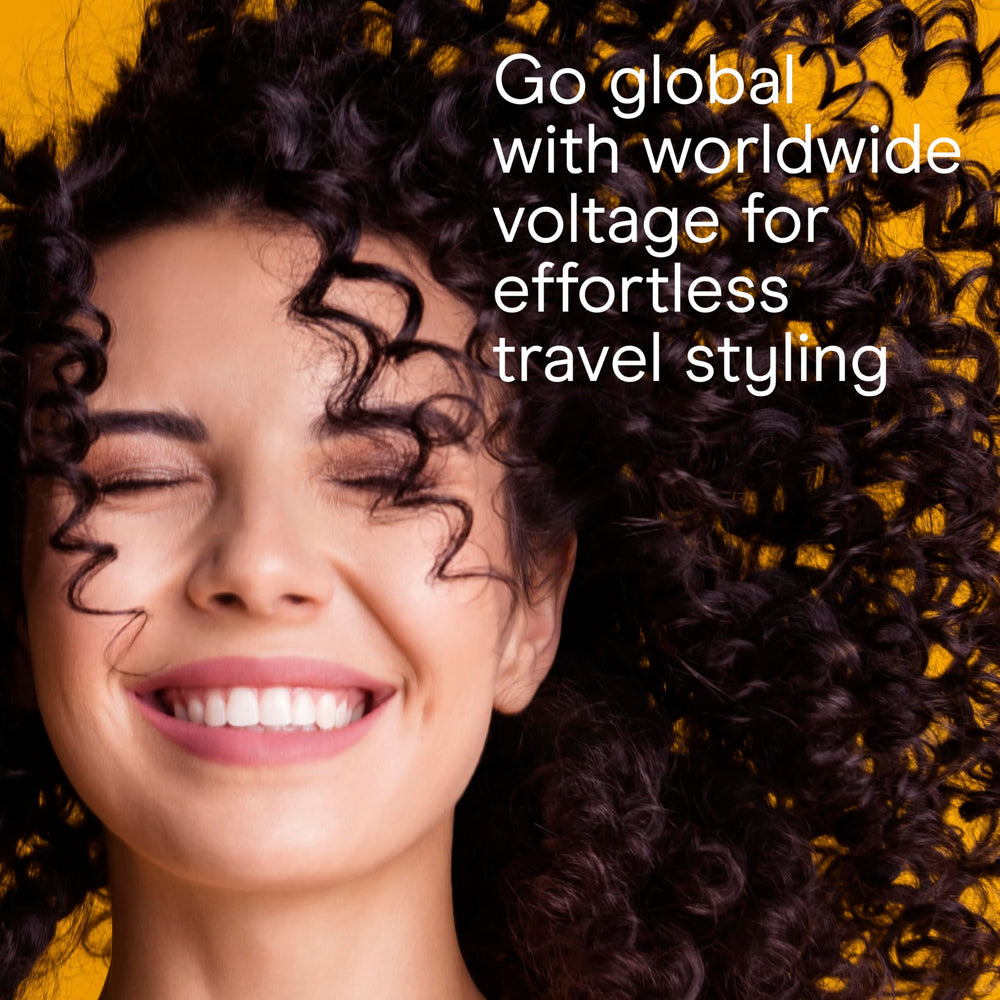 Conair curling iron held in hand to show compact size and easy travel benefit