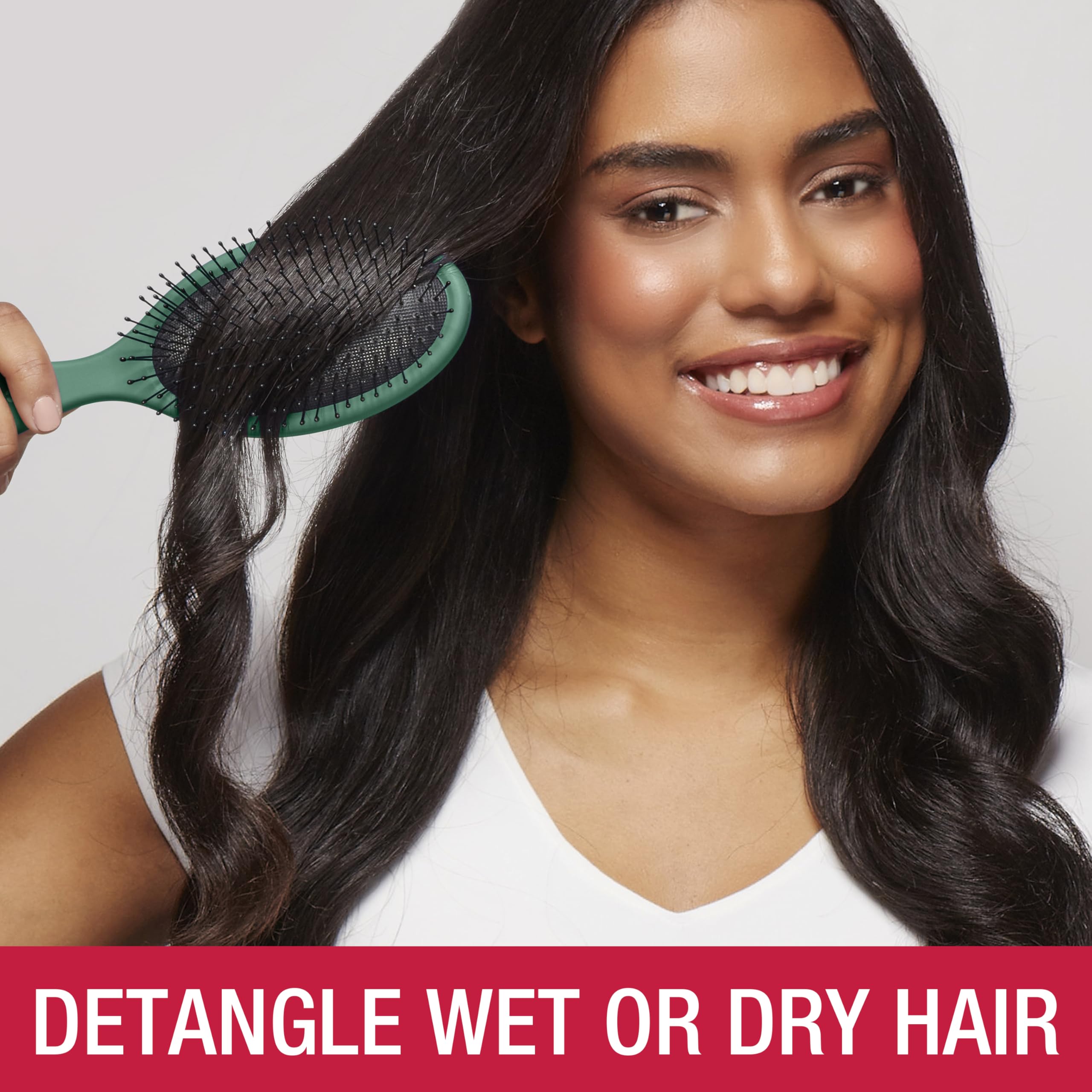Conair tartan in-use on wet hair demonstrating gentle glide and quick knot removal
