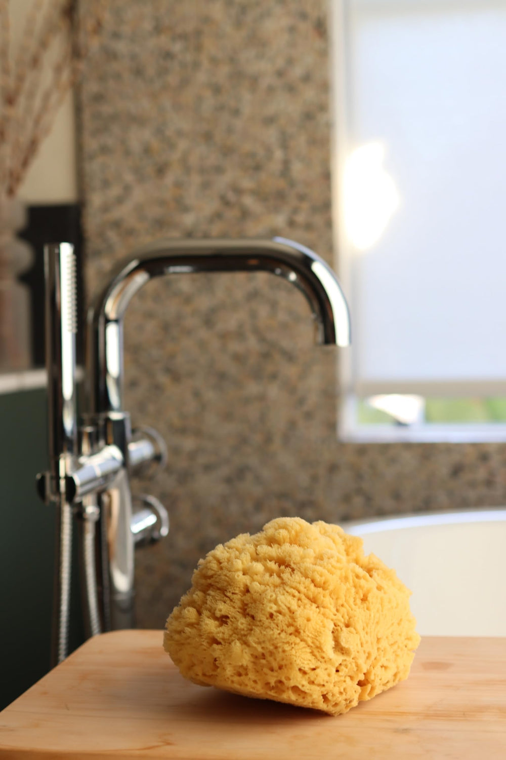 Constantia Beauty sponge producing lather in hand for efficient cleansing benefit