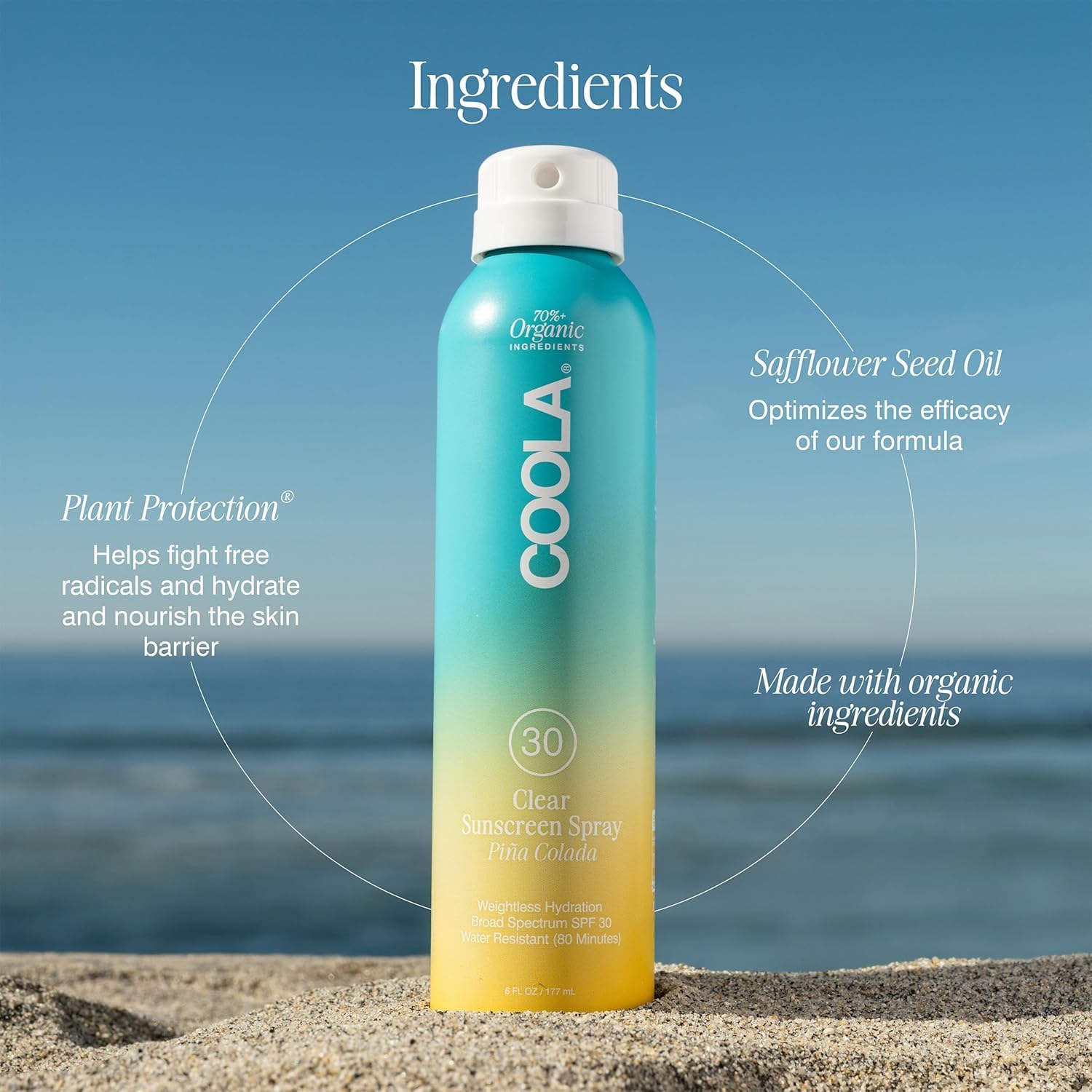 COOLA bottle held in hand for scale showing portable 6 fl oz travel-ready size