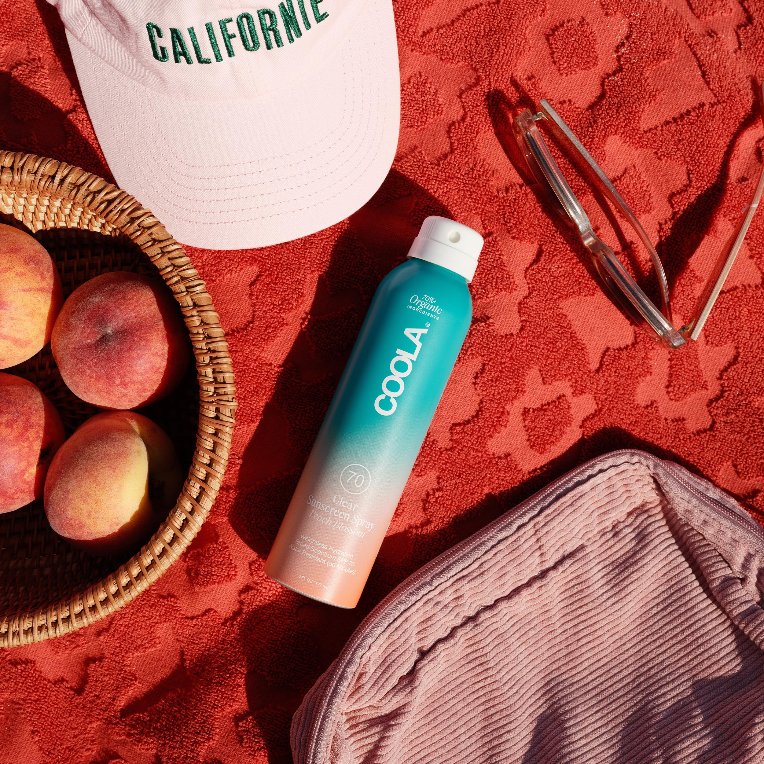 COOLA sheen on arm showing ultra‑sheer finish and quick absorption