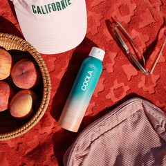 COOLA sheen on arm showing ultra‑sheer finish and quick absorption