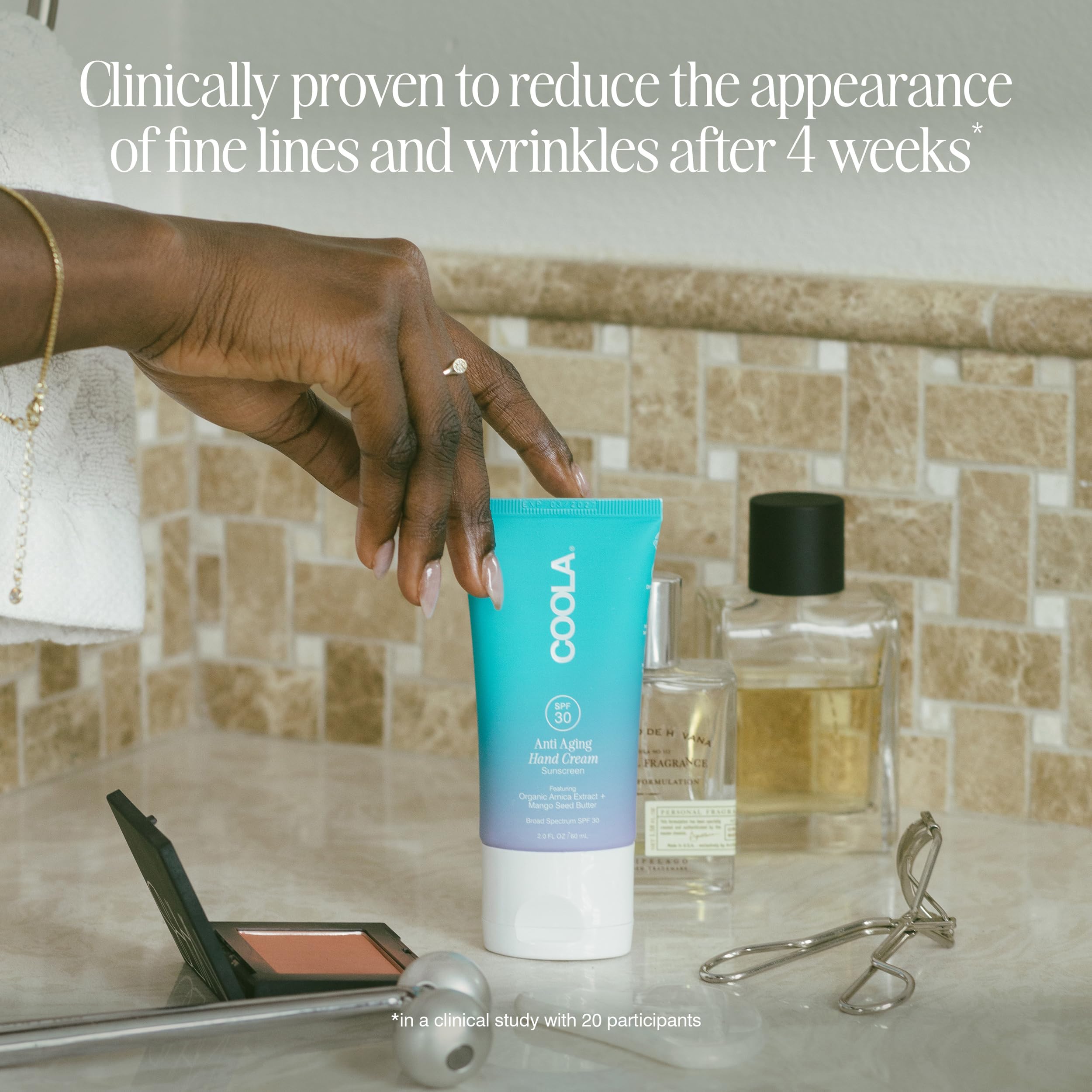 COOLA ingredients flatlay with botanicals showing antioxidant benefits