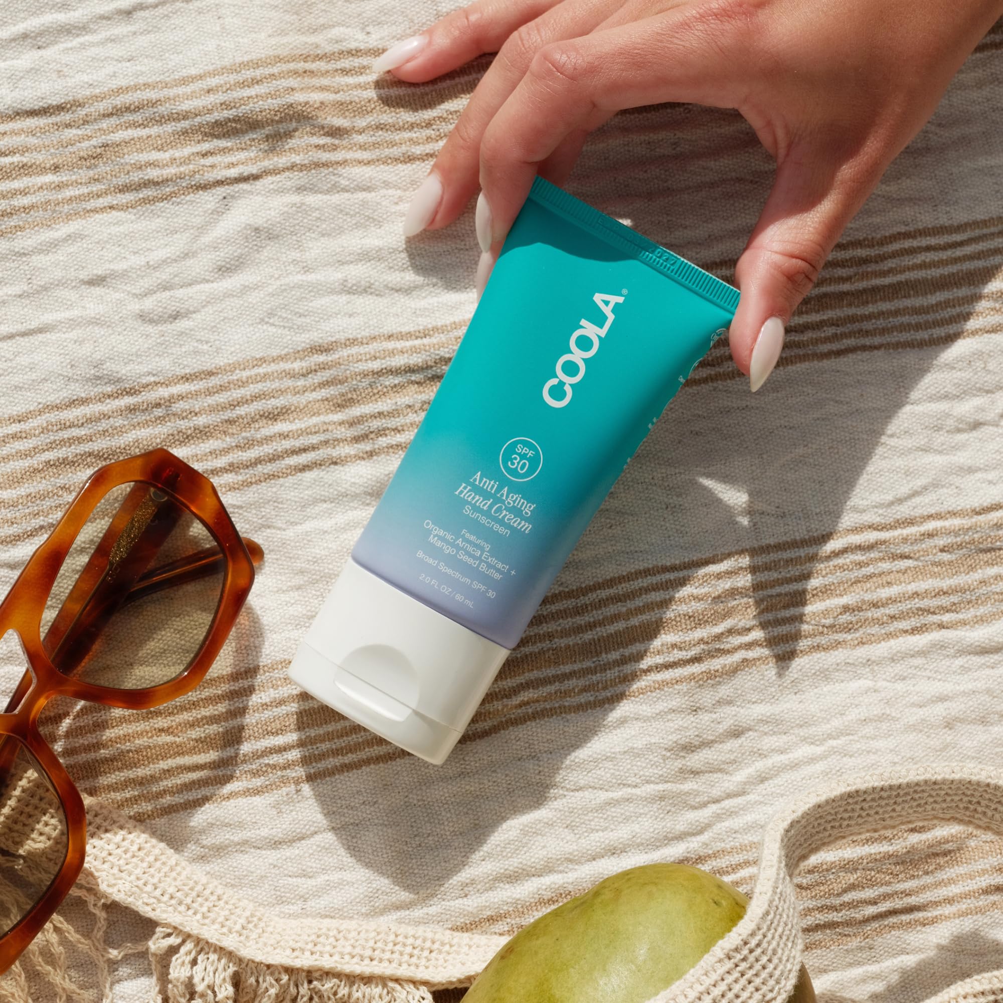 COOLA tube label detail highlighting organic ingredients and SPF