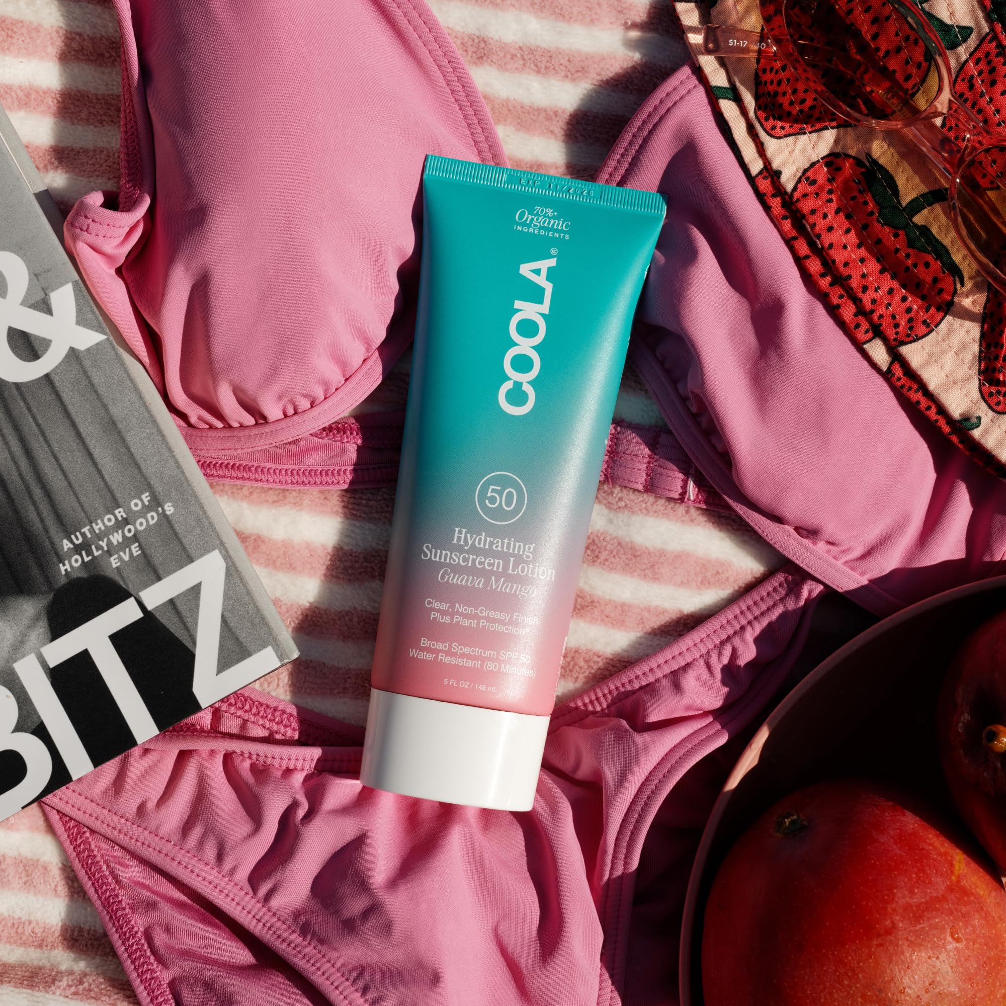COOLA sunscreen applied at beach demonstrating broad-spectrum protection