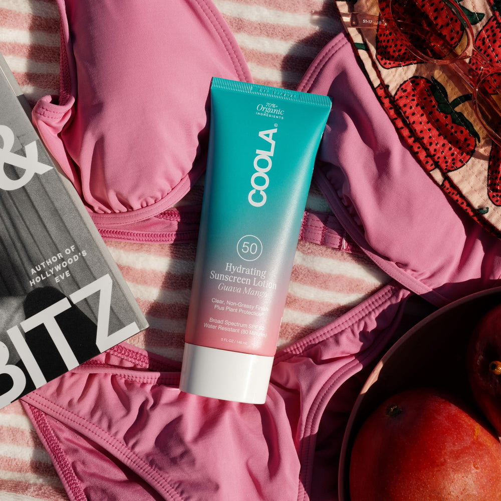 COOLA sunscreen applied at beach demonstrating broad-spectrum protection