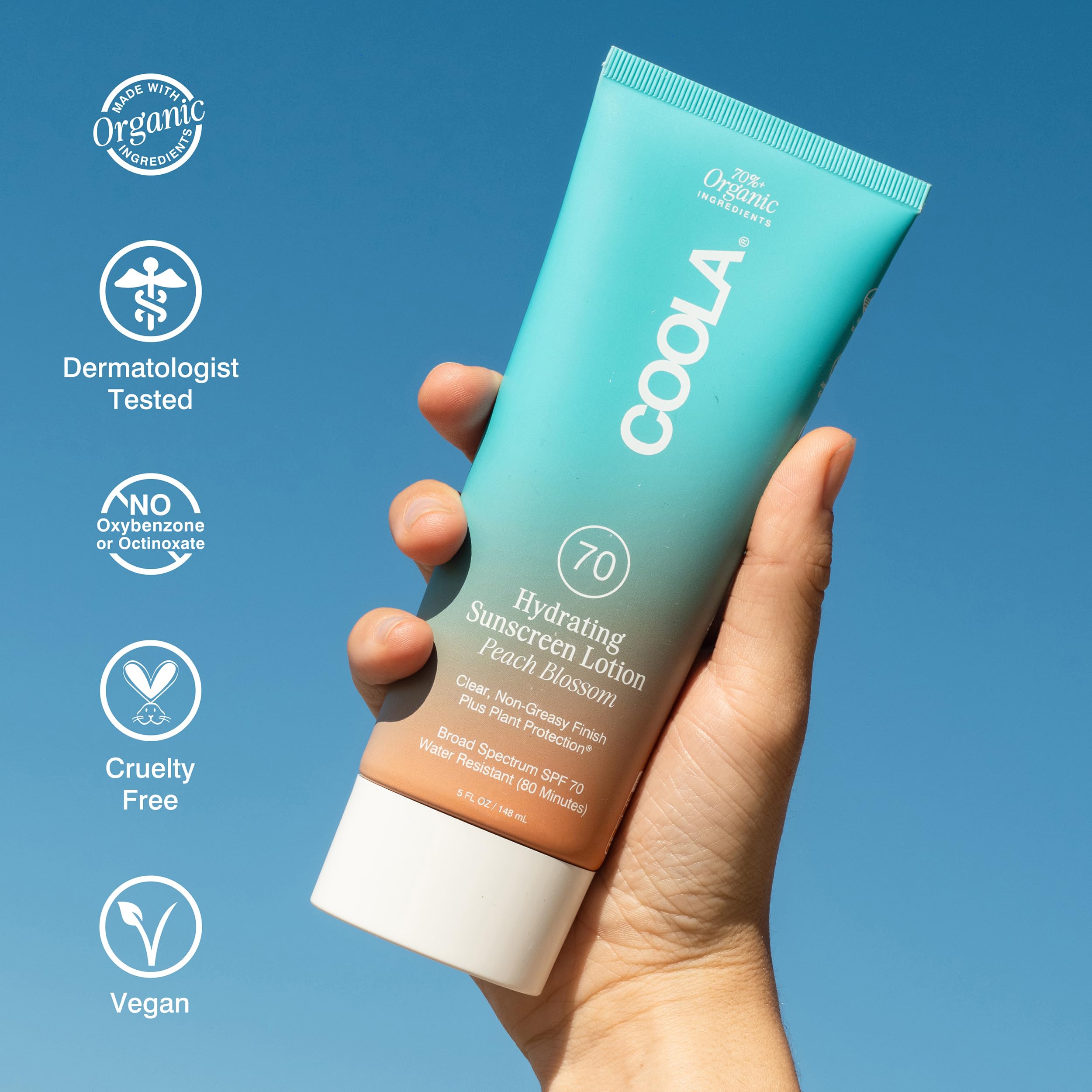COOLA applied to forearm demonstrating sheer, non-greasy finish