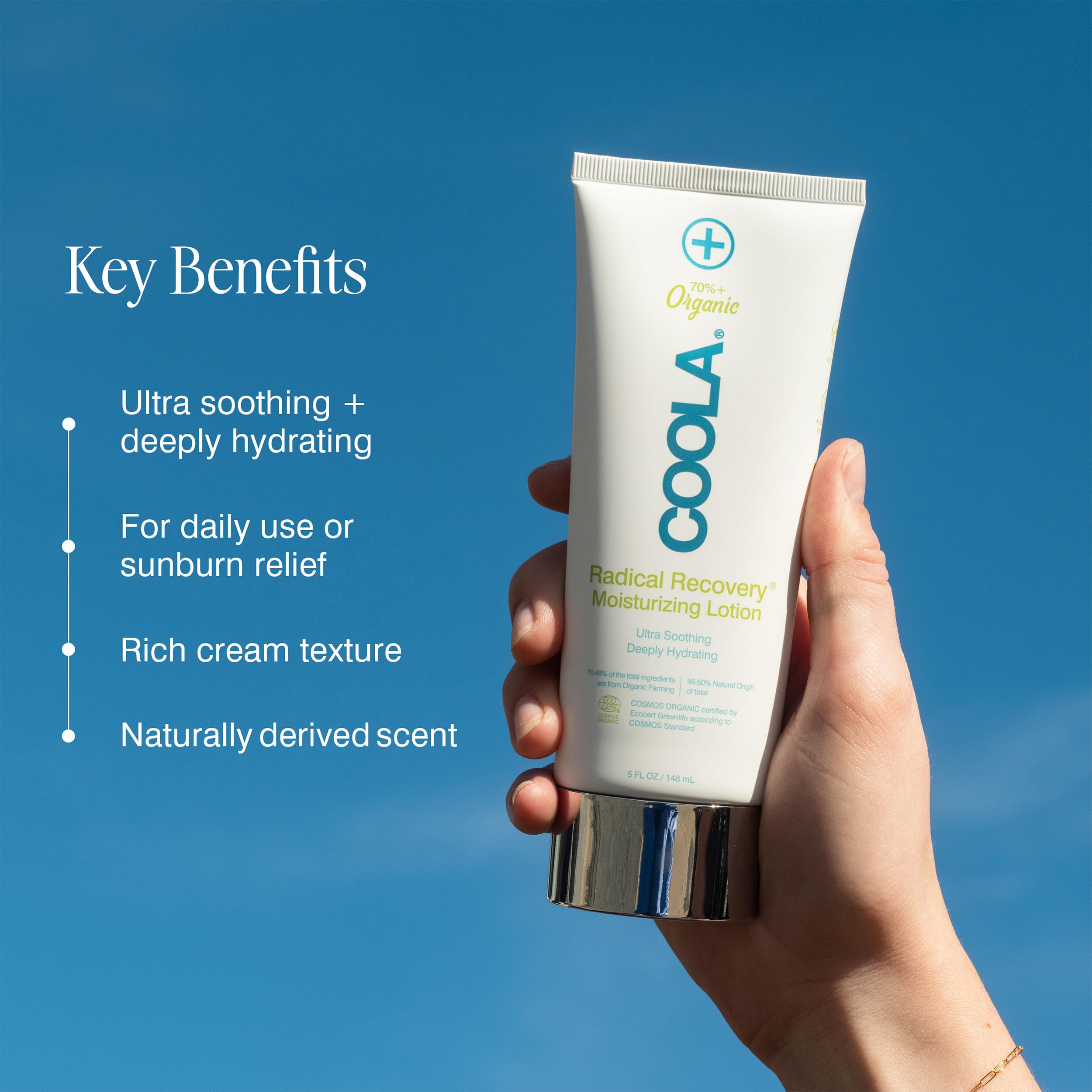 COOLA after-sun lotion applied on arm demonstrating soothing absorption benefit