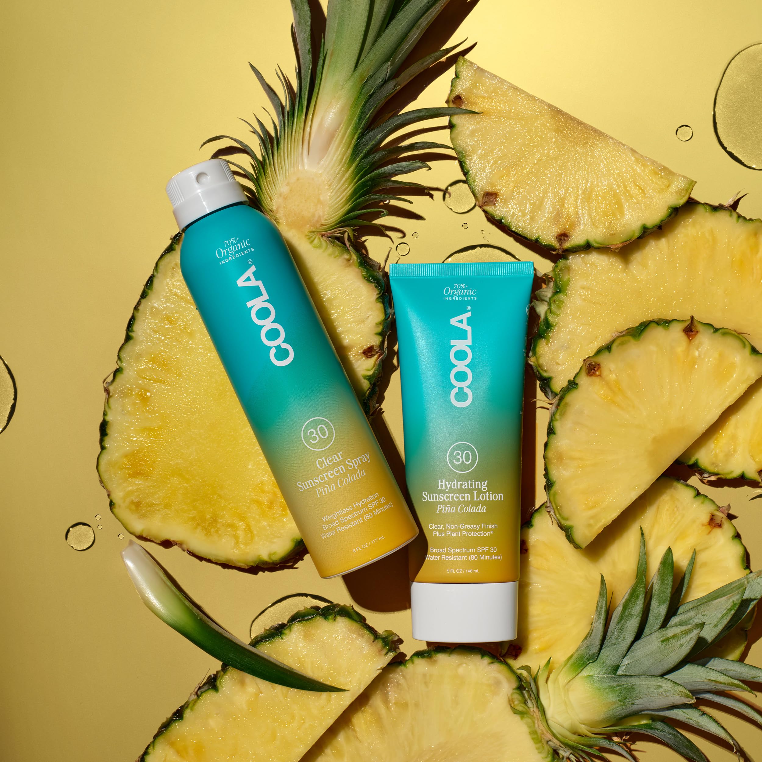 COOLA bottle spraying upside down to show continuous misting convenience