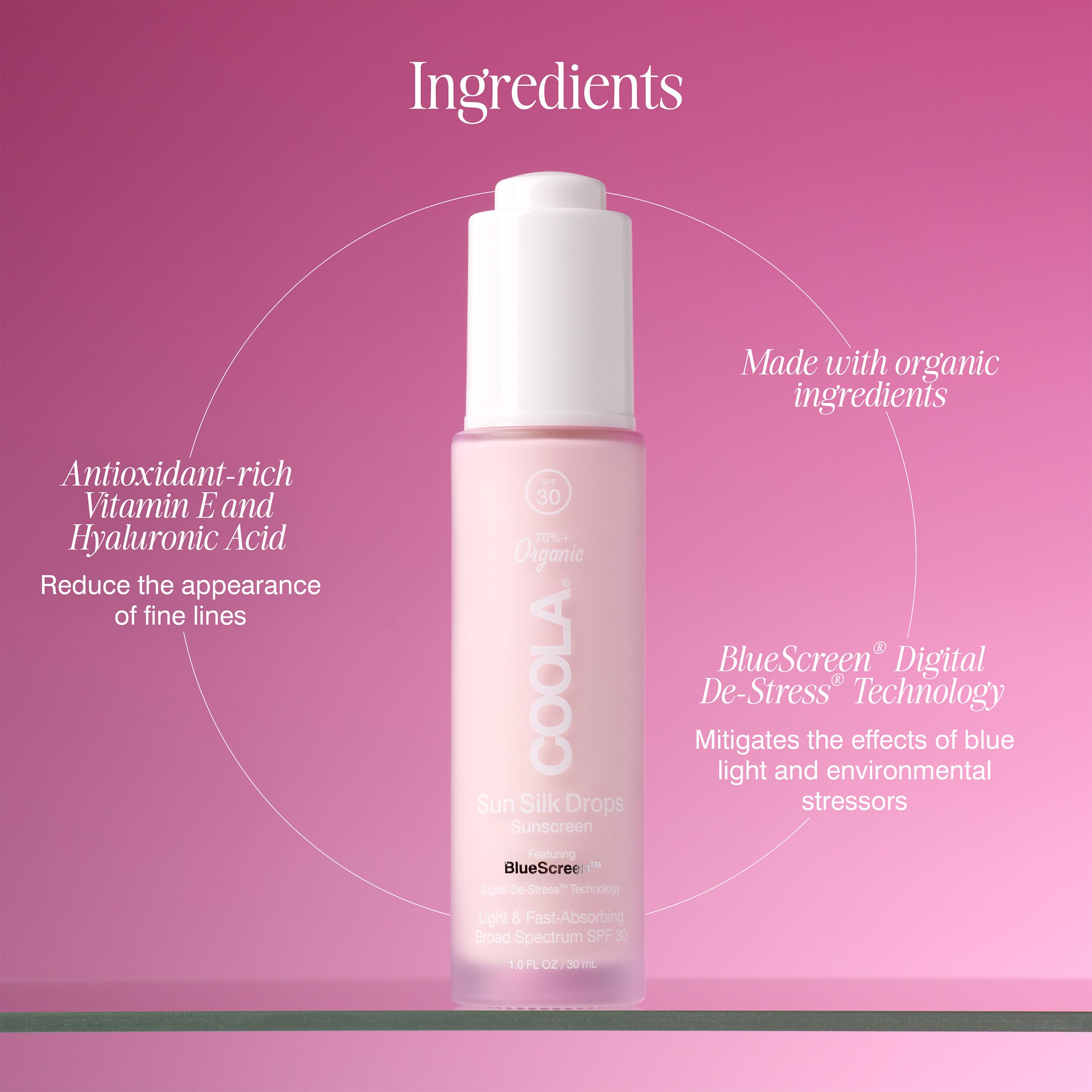 COOLA Sun Silk Drops 1 fl oz beside travel bag showing portable daily protection