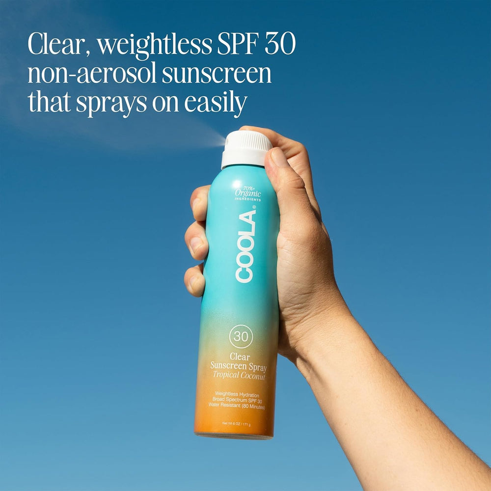 COOLA mist spraying in air demonstrating quick full-body coverage