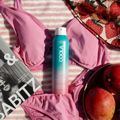 COOLA mist texture captured midair showcasing lightweight, non‑greasy feel