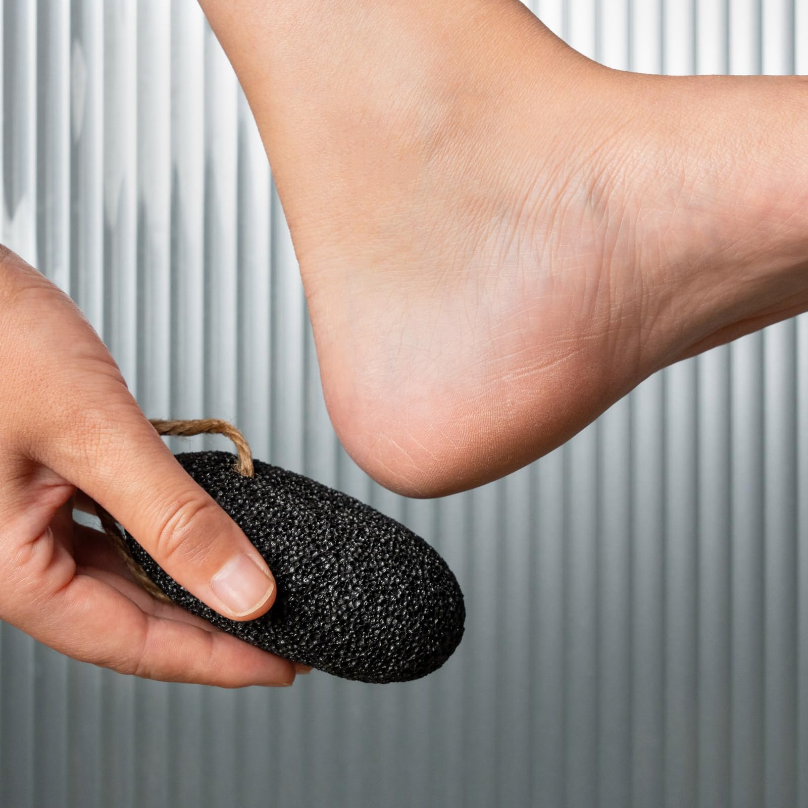 CopesFuda pumice stone being used in shower to exfoliate callused areas