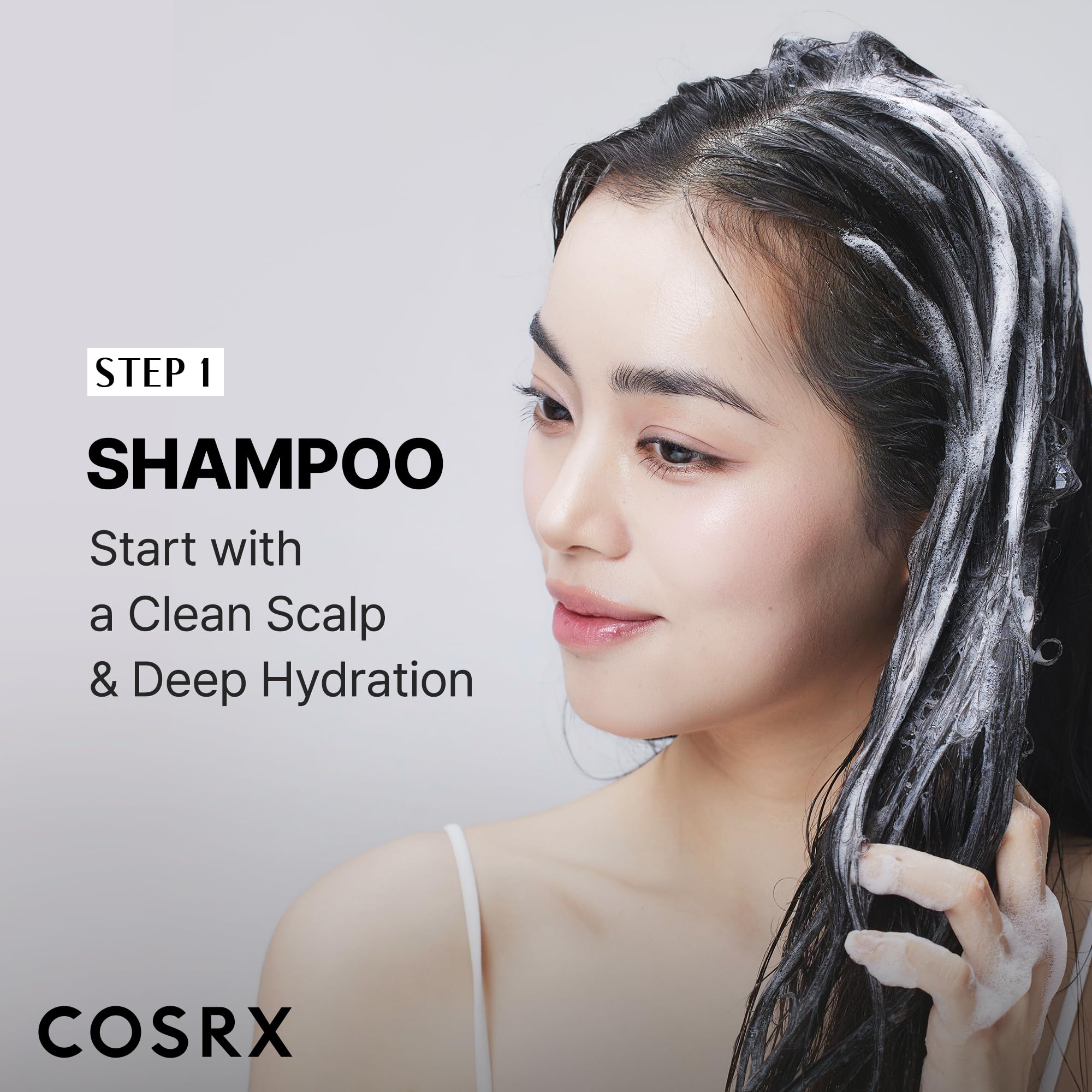 COSRX products in hand showing travel-friendly sizes for on-the-go hair repair