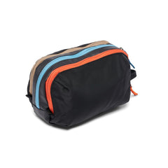 Cotopaxi Nido accessory bag open displaying three compartments and interior zip pocket for organized storage