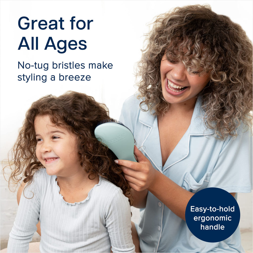 Crave Naturals smoothing through curly hair to loosen knots and preserve curl shape