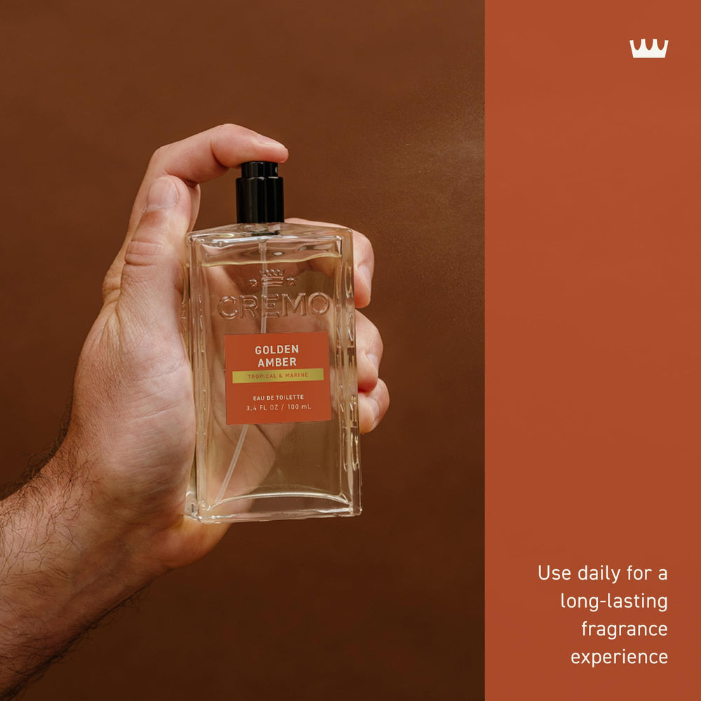 Hand-held Cremo Golden Amber bottle demonstrating comfortable grip and portability