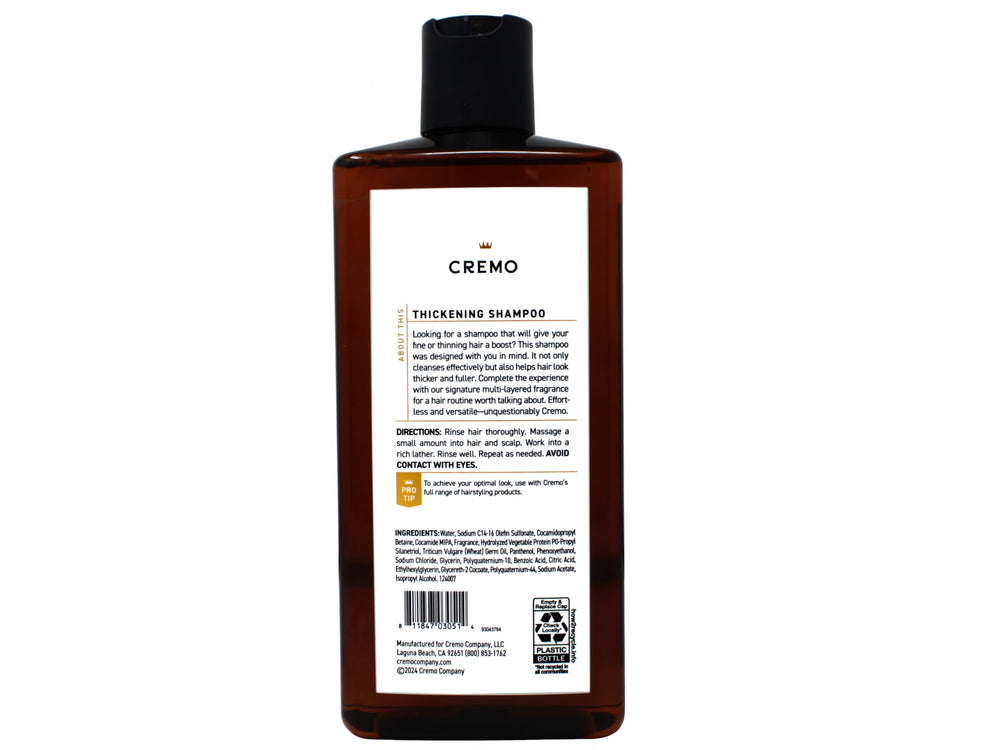 Cremo bottle in shower with lather demonstrating easy use and gentle cleansing benefit