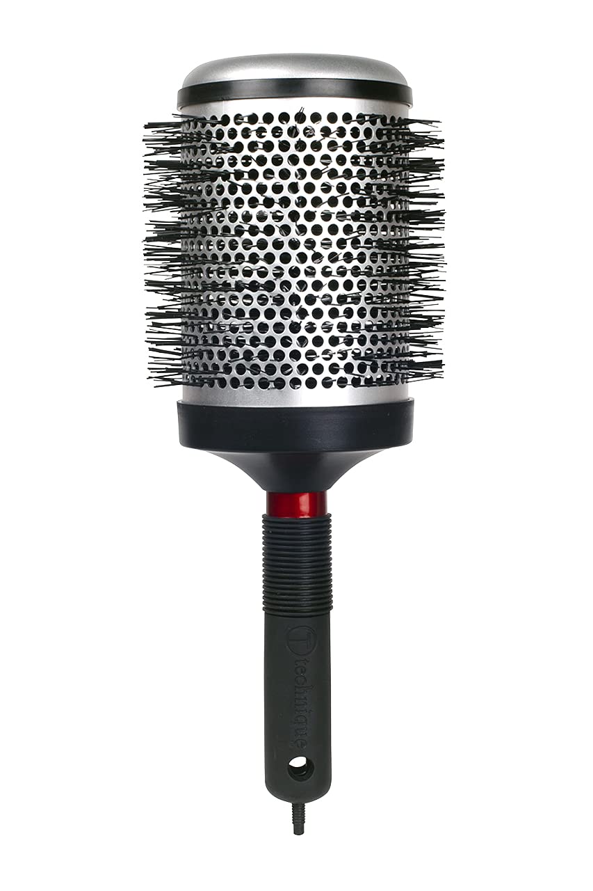 CRICKET brush in use with a blow dryer speeding styling and smoothing hair