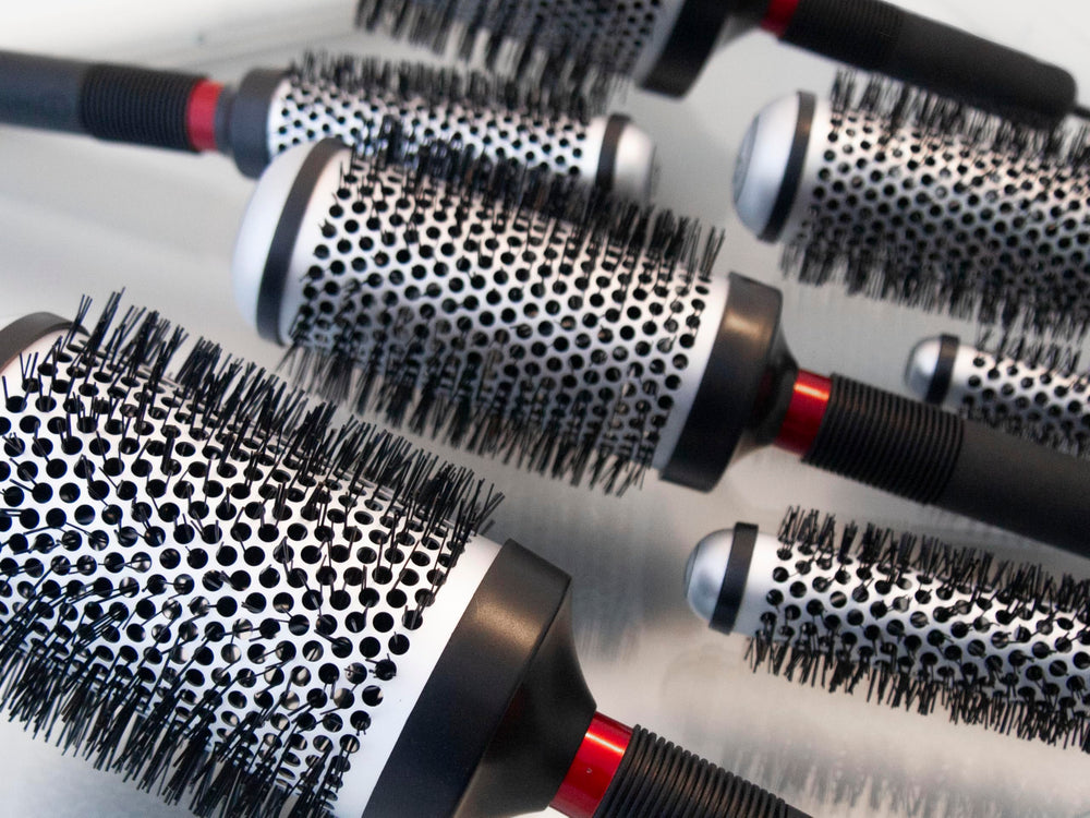 Cricket brush with travel pouch indicating portability and professional performance