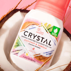 Crystal Essence roll-on held in hand to show size and easy travel benefit