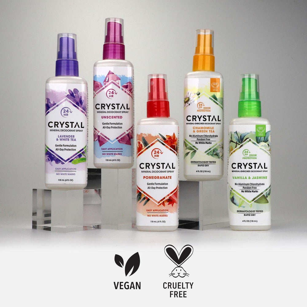 Crystal Essence next to a hand showing compact 4-ounce travel-friendly size