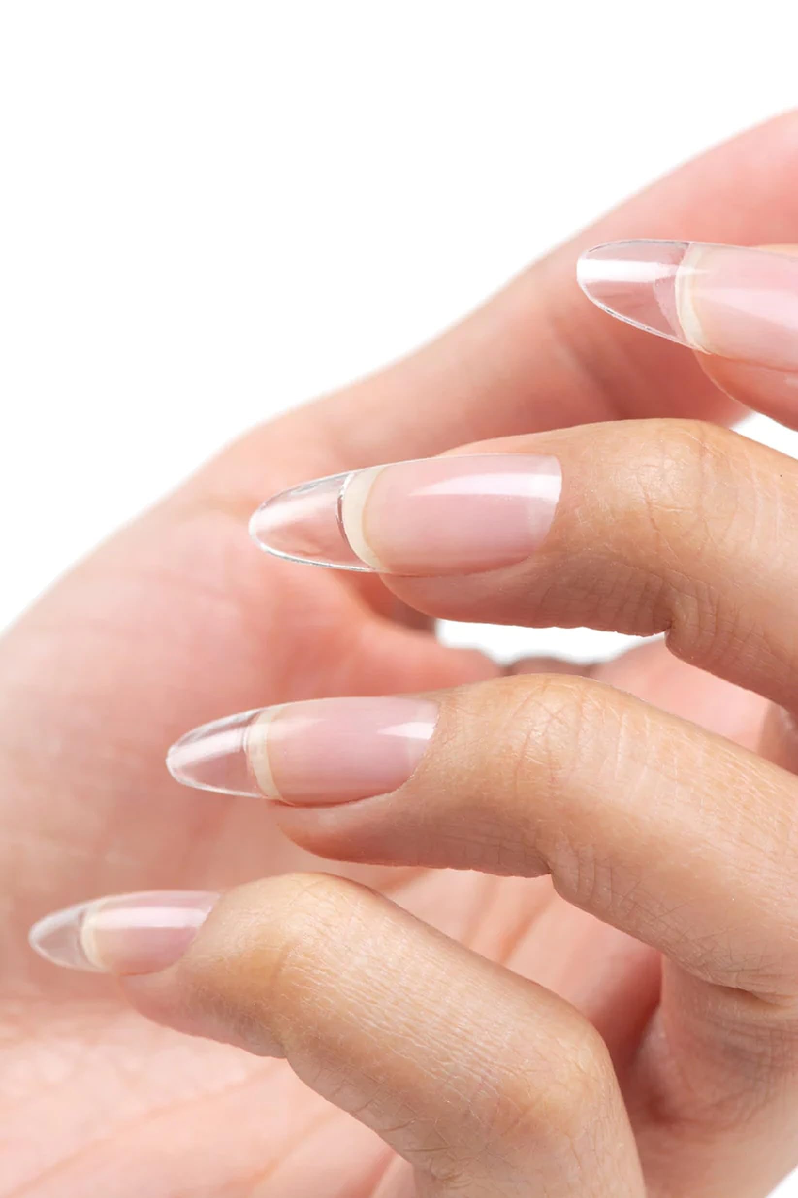 Technician applying Cuccio Pro builder gel in salon for durable nail enhancements